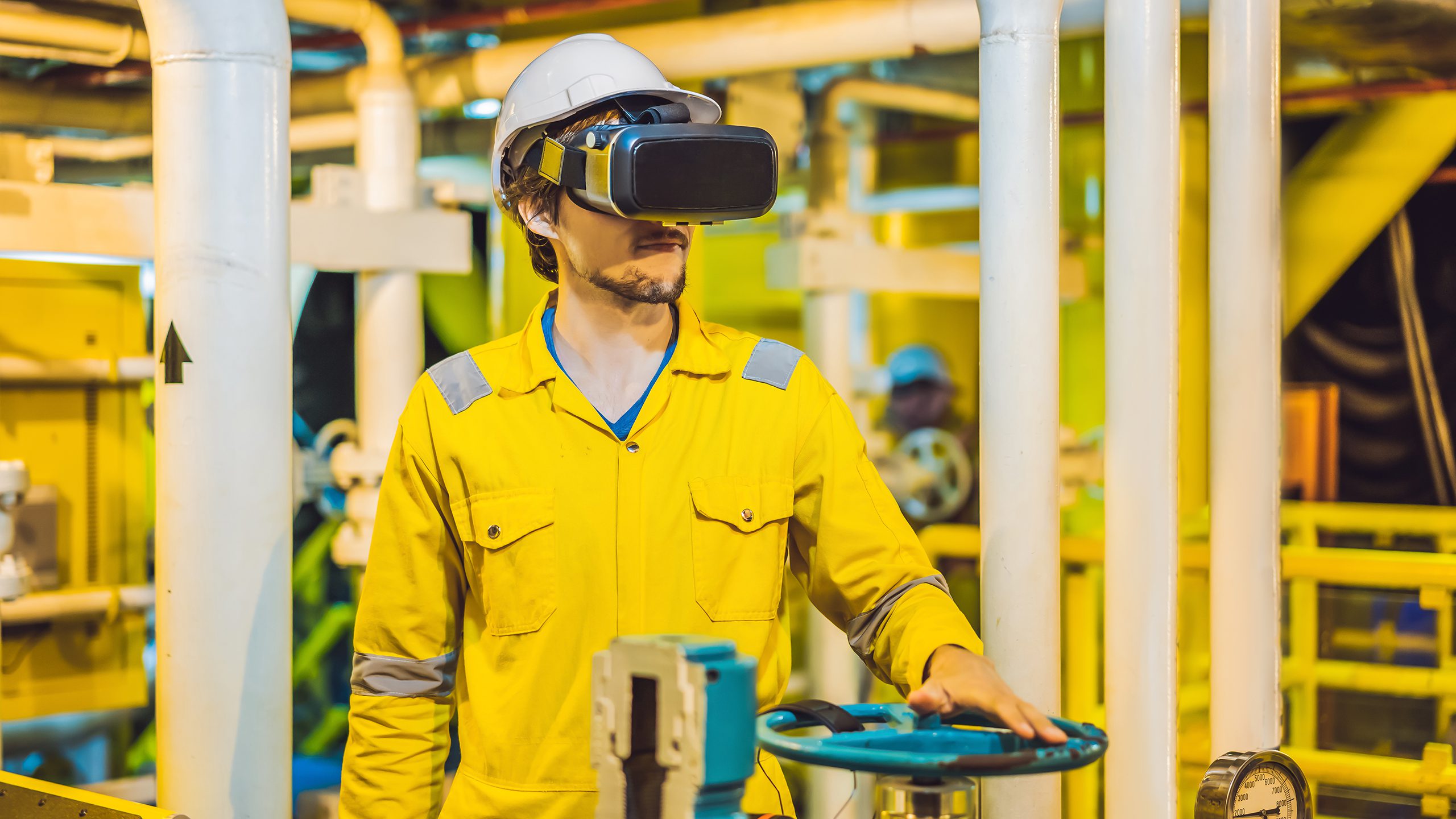 A man wearing a VR headset in an industrial setting